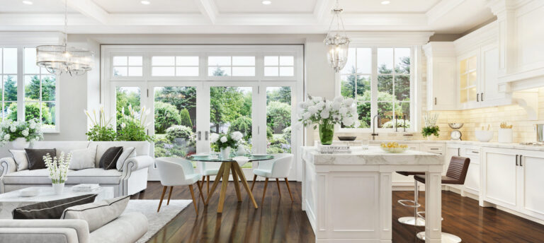 Schönes Interieur mit Kunstblumen in weißer Küche und Wohnzimmer